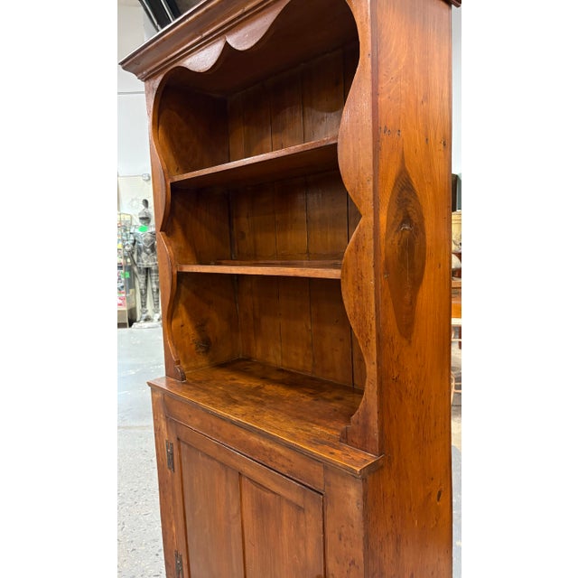 This is an early 20th century handcrafted American pine hutch. This rustic hutch features a beautiful carved scalloped...