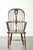 We are pleased to offer this elegant antique English early 19th-century Windsor highback chair, featuring a beautiful...