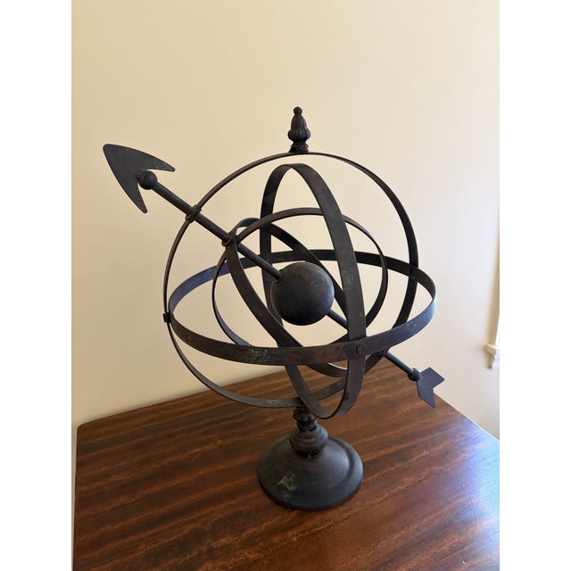 A beautifully crafted iron armillary sphere, evoking the timeless elegance of classical European gardens. Pieces like this...