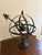 A beautifully crafted iron armillary sphere, evoking the timeless elegance of classical European gardens. Pieces like this...