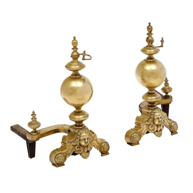 A pair of French antique andirons made of finely cast bronze. These pieces are adorned with the face of Beethoven. They...