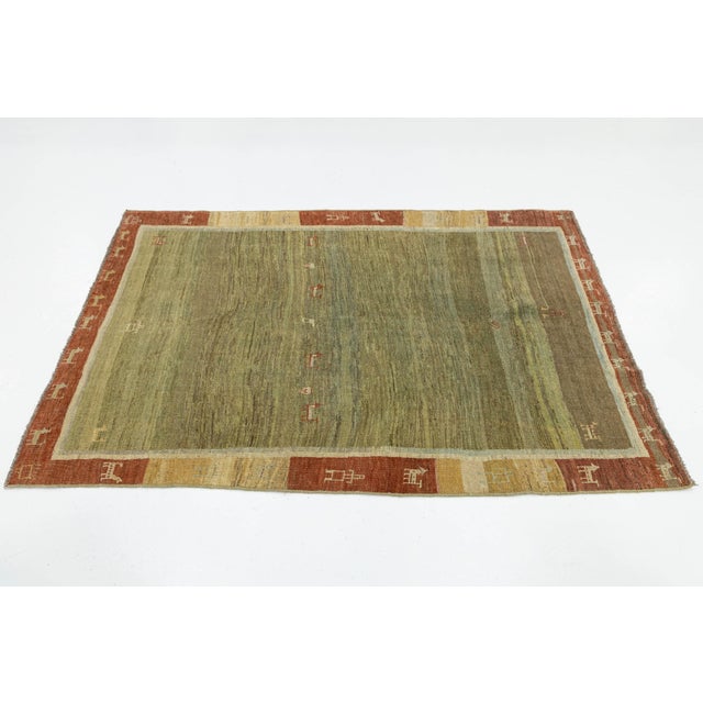 2010s Modern Hand-Knotted Gabbeh Wool Rug – Earth Tones With Minimalist Animal Motifs For Sale - Image 5 of 8