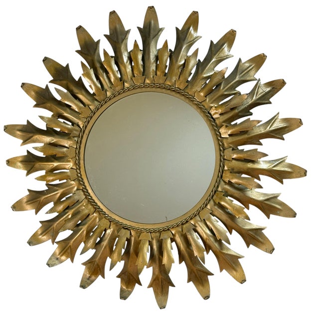 Huge round wrought iron sunburst mirror from the 1950s. Italian handcrafted, decorated with leaves.