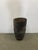 Tall outdoor stone planter reminiscent of an antique industrial crucible. Natural patina. Dimensions:17" D x 30" H