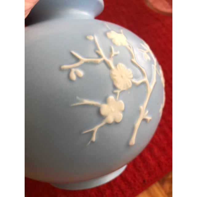 The Copeland Spode, England blue vase with cherry blossoms is a medium-sized round porcelain piece from the 1950s. This...