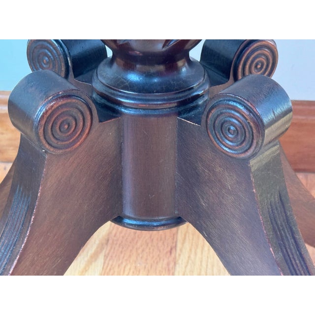 Vintage Mahogany Pedestal Side Table with Carved Scroll Details Elegant vintage pedestal side table featuring a warm dark...
