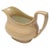 Antique English drabware creamer with spout and handle, circa 1800. Gilt accent. No maker's mark.