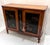 An exquisite late 19th to early 20th-century European Chinoiserie-decorated server cabinet, blending classic Continental...