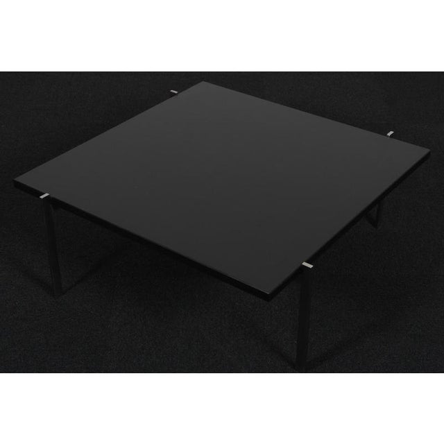 Poul Kjærholm coffee table with frame of stainless steel. Top of slate. Model PK61, stamped by Fritz Hansen. Possible to...