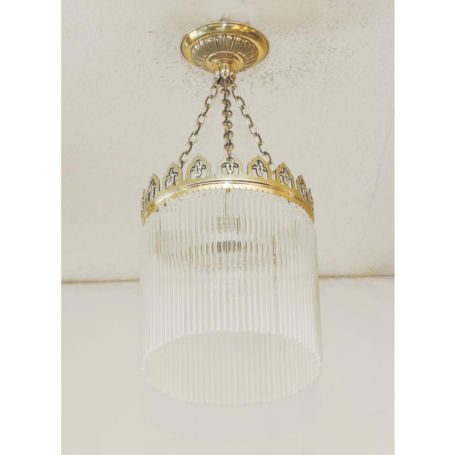 Art Nouveau Pendant Lamp Art Nouveau lamp made around 1915. Solid brass ring with ornamental openwork design. Suspended on...