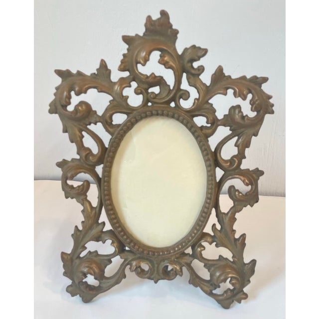 Beautiful and heavy baroque Hollywood Regency picture frame. Opening is 3.5” x 5”