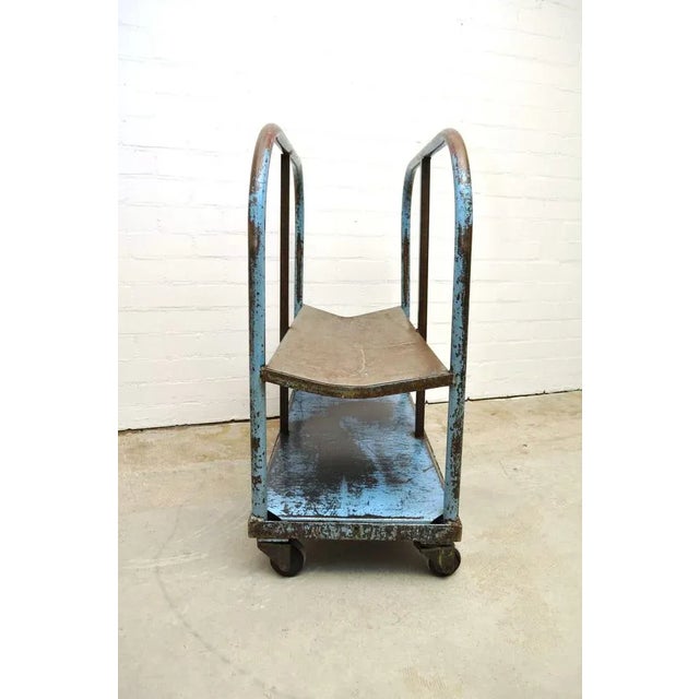 Special industrial cart with hollow curved carrier. Four castors. Great item to showcase something, for example....