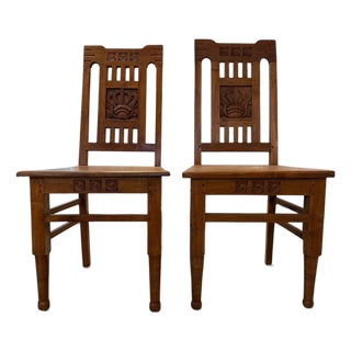 Pair of Vintage Dutch Colonial Hand-Carved Teak Crown Motif Dining Chairs For Sale