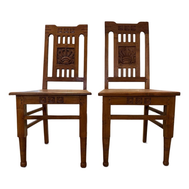Pair of Vintage Dutch Colonial Hand-Carved Teak Crown Motif Dining Chairs For Sale
