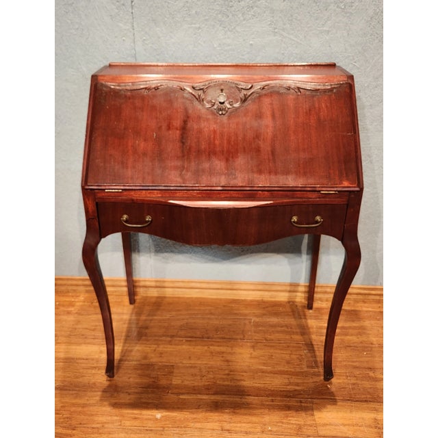 Antique Mohogany Drop Front Secretaire Writing Desk This elegant antique secretary desk, crafted from genuine mahogany,...