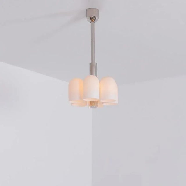 Polished nickel 6 pendant light by Schwung Dimensions: D 31.4 x H 59.7 cm Materials: Polished nickel, frosted glass...