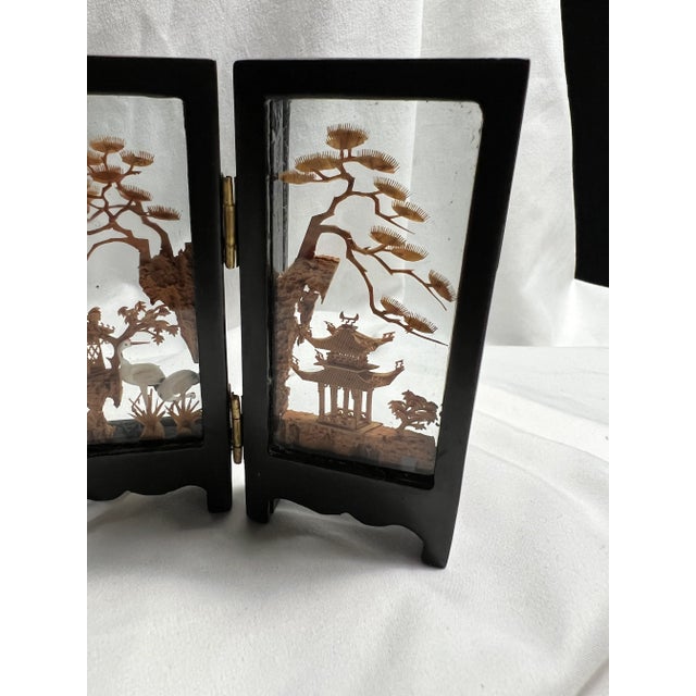 This listing is for a small Asian 4-panel hinged folding screen. It features four different intricately hand-carved cork...