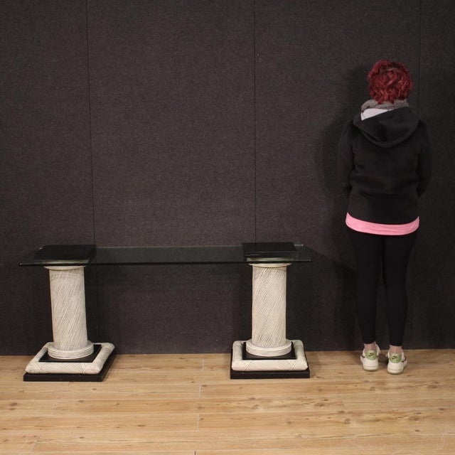 Particular design console, Spain from the 70s/80s. Furniture composed of two columns adorned with wicker with black...