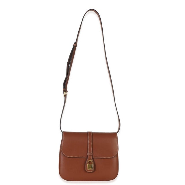 Item #: 153827 Features Interior: Two gussets One zip pocket Dimensions: 9 x 7.5 x 3 in Handbag Closure Type: Snap Strap...