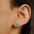 These elegant stud earrings are crafted in 925 sterling silver and feature two natural octagon-cut emeralds, each...