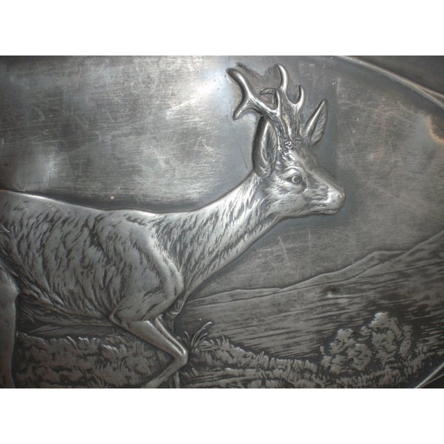 Lovely scenic Pewter Platter with a Roe Deer walking through the forest with Mountains in the background. Pinecone boughs...
