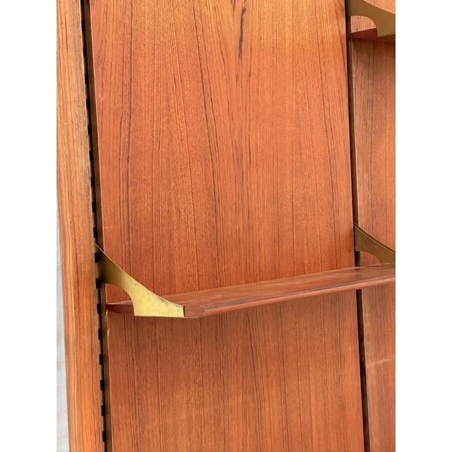 Vintage Modular Wall Bookcase in Teak, 1970s, in Flawless conditions. Designed 1970 to 1979 This piece has an attribution...