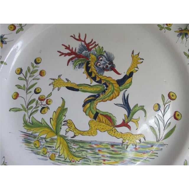 A lovely Antique French Desvres Charger, Plaque or Plate. The Charger is faience and has a hand painted decoration of a...