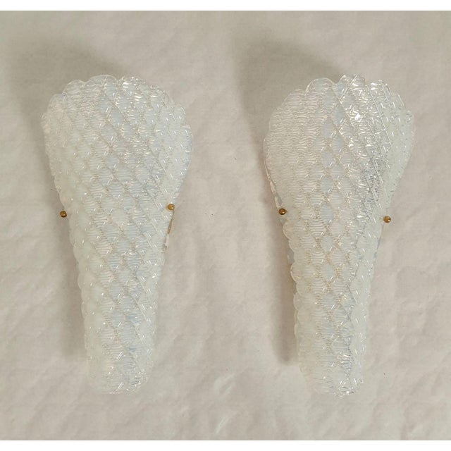 Pair of opaline Murano glass sconces, Mid Century Modern, attributed to Mazzega, Italy 1970s. The Italian sconces are made...