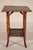 Aesthetic movement bamboo and lacquer side table, circa 1910. With a black and red lacquer top with floral and bird...