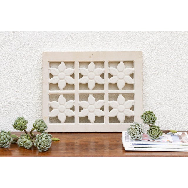 This enchanting stone panel showcases a meticulously carved lotus flower design, a timeless symbol of purity and elegance...