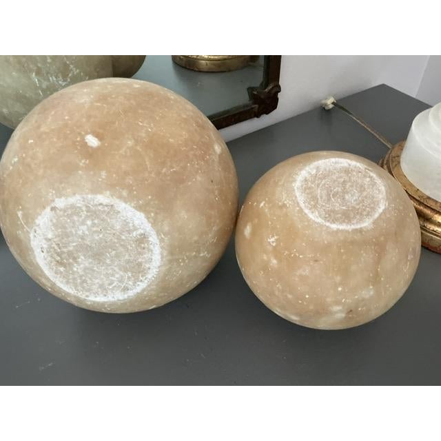 Beautiful alabaster balls for bookends or other decor uses. Lovely aged to perfection with slight markings, scuffs and...