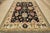 A traditional Oushak rug hand-knotted with an all-wool pile on a cotton foundation. This oriental rug features an all-over...