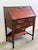 Antique Victorian Slant Front Carved Secretary. Slant front opens to reveal pigeonhole compartments, 2 drawers, and center...