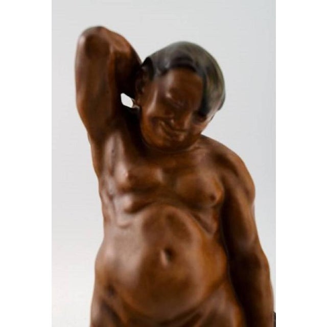 Bing & Grondahl figurine of a man standing with grapes by Kai Nielsen (1882–1924). Model number 4025. From the series...