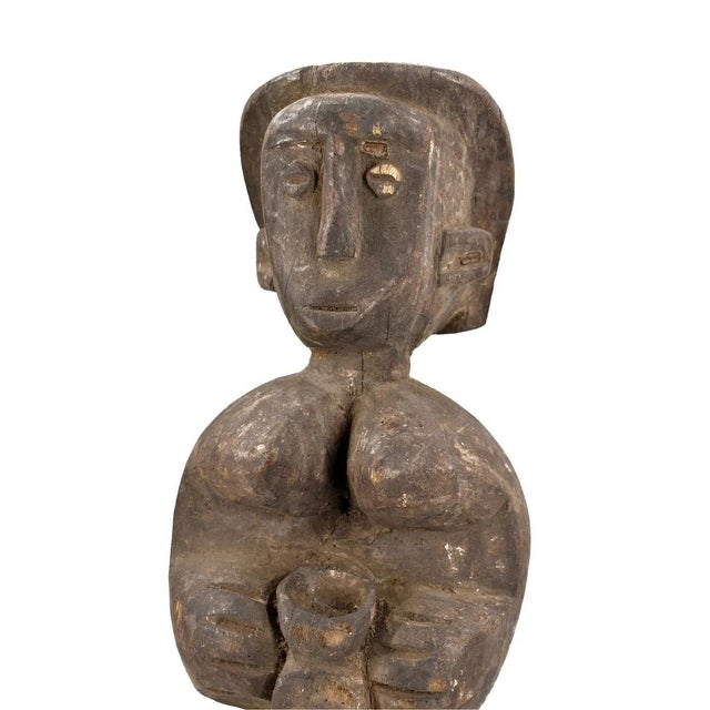 The Mambila Tadep Guardian Figure, originating from the Mambila people of Cameroon, is a culturally significant artifact...