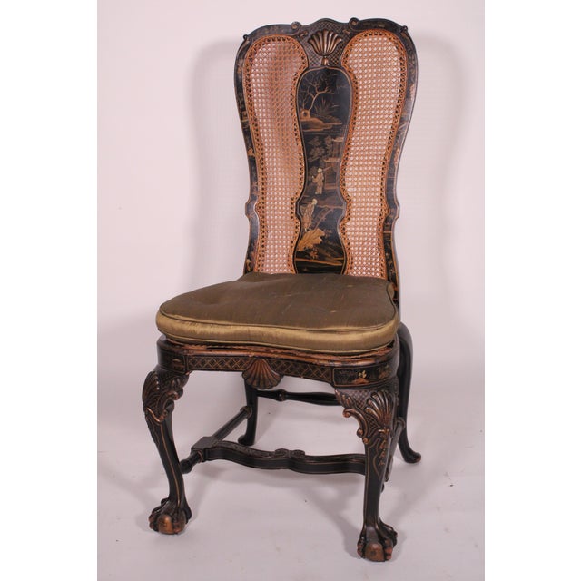 George II style black chinoiserie decorated side chair, circa 1950's. With a cupids bow crest rail with a central raised...