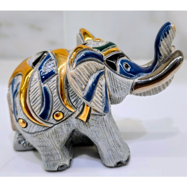 Bring home a beautifully detailed De Rosa Rinconada elephant figurine, handcrafted and hand painted in Montevideo,...
