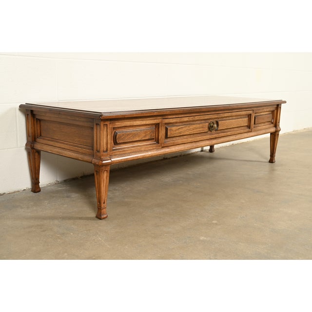 A gorgeous mid-century French Regency Louis XVI style coffee table or cocktail table By Thomasville USA, Circa 1960s...