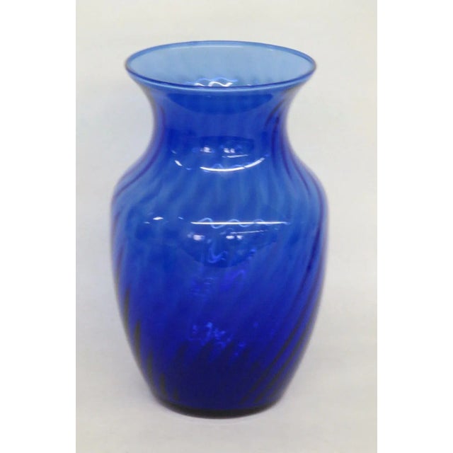 This beautiful Vase is made out of hand blown glass. This Vase features a gorgeous cobalt blue color and a wonderful...