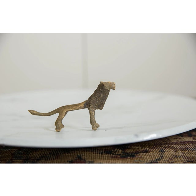 :: Vintage handmade African bronze black-maned lion. Circa mid 20th century and possibly older, this piece has such...