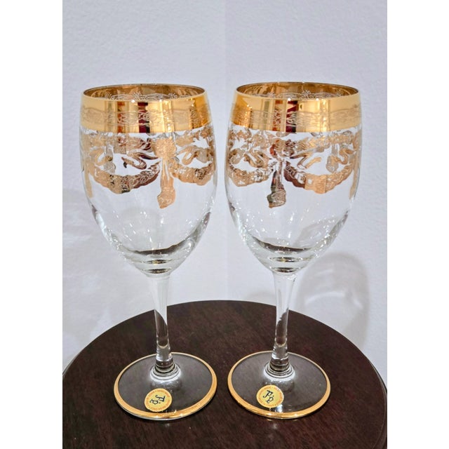 Elevate your dining experience with this set of two handcrafted Italian wine glasses by F&P. Each glass features luxurious...