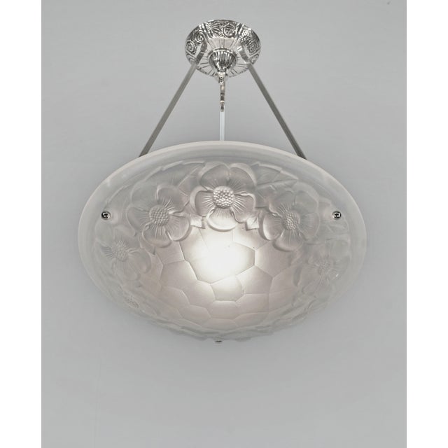 Degué A signed French art deco pendant light made c. 1930 in nickel plated bronze or solid brass. The mounting holds a...