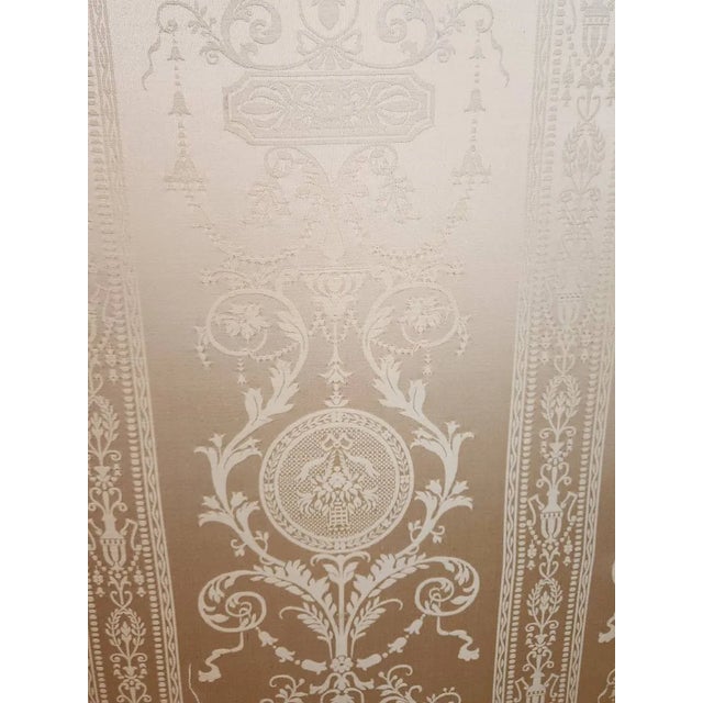 An exceptionally elegant three-panel carved giltwood folding screen, richly ornamented in the Rococo tradition. Each...