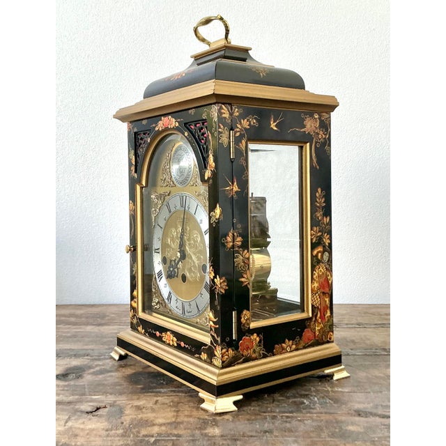 This exceptional mantel clock by the renowned Comitti of London is a masterful celebration of traditional English horology...