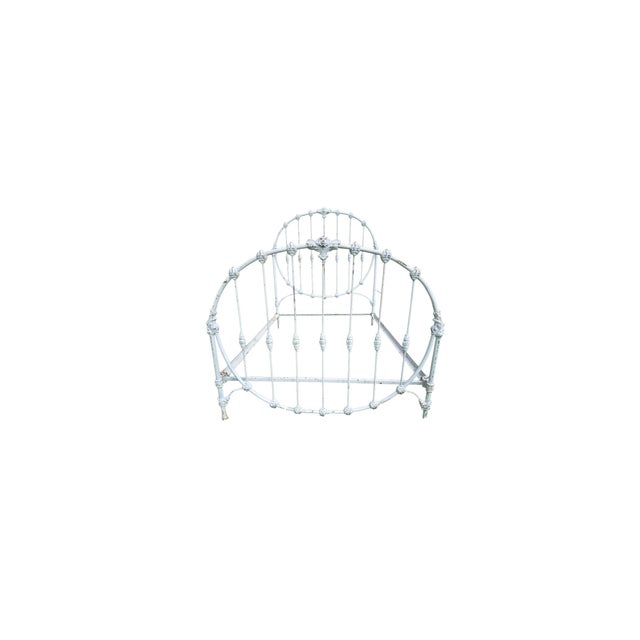 Fabulous late 19th-century American Victorian cast iron bed frame with stunning detail and oval head and footboard....
