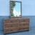 A charming Boho Chic two-piece bedroom set featuring a woven wicker dresser and coordinating wall mirror. The dresser...