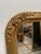 Elegant Louis Philippe gilt wood mirror with beautifully rounded corners and refined floral carvings in relief. The warm...