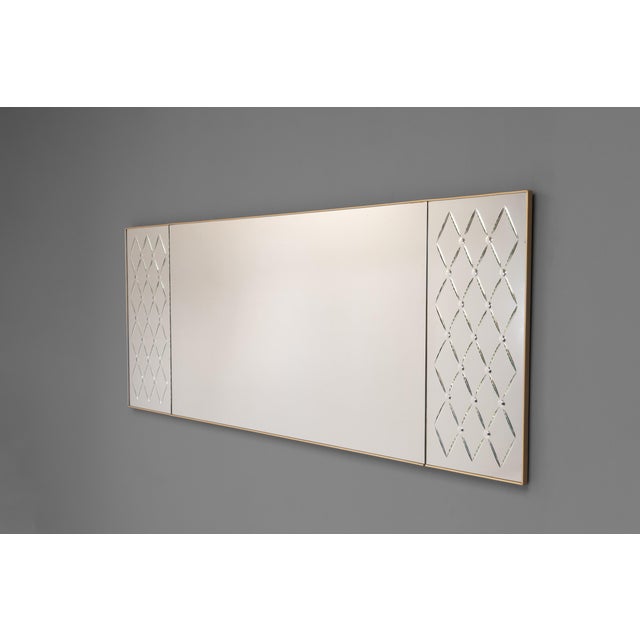Three panel mid-century landscape mirror with decorative end panels and gold beaded edge. Circa 1960.