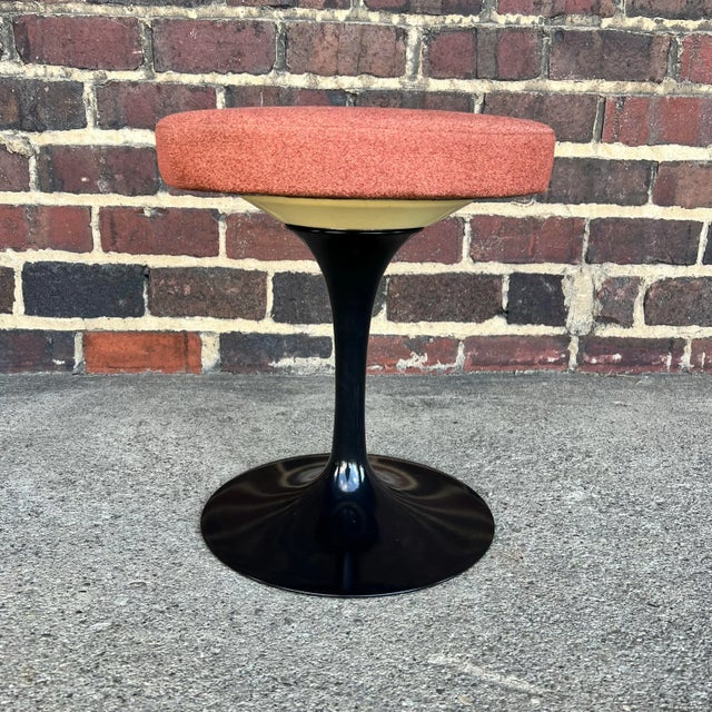 This is an authentic Eero Saarinen for Knoll Tulip stool. Featuring an upholstered swivel seat, this stool stands on a...