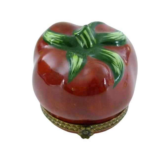 Juicy ripe Porcelain Tomato with bright Green leaves opens in the center to display the hand written Hallmark ("Limoges...